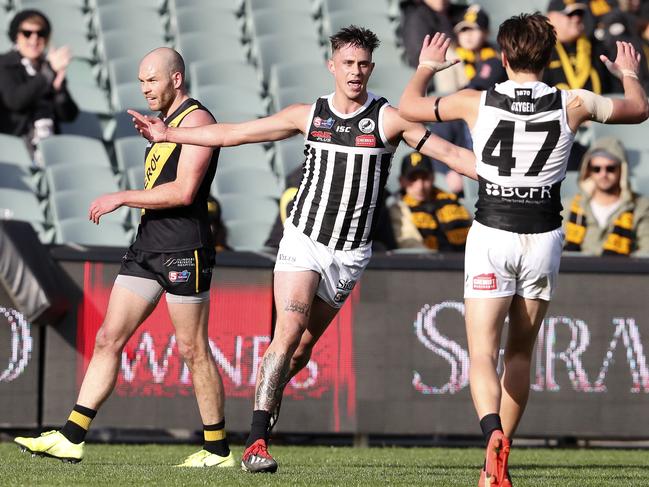 Aidyn Johnson celebrates a goal with Tobin Cox during Port Adelaide’s win over Glenelg in their second semi-final clash at Adelaide Oval. Picture SARAH REED