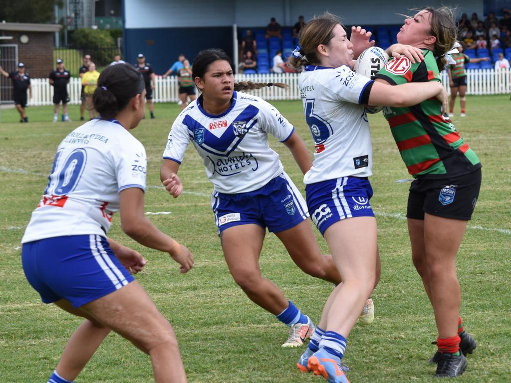 Mackenzie Schoultz is tackled by Abby Aros. Picture: Sean Teuma. Tarsha Gale Cup