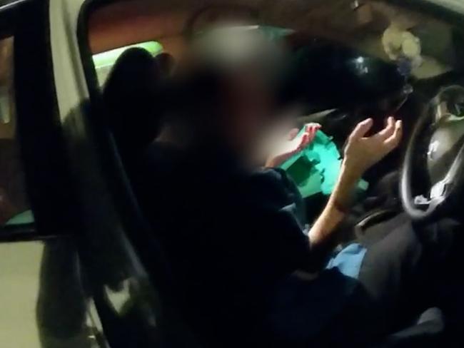 Police footage of a woman allegedly blowing more than seven times over the legal limit. Picture: QPS