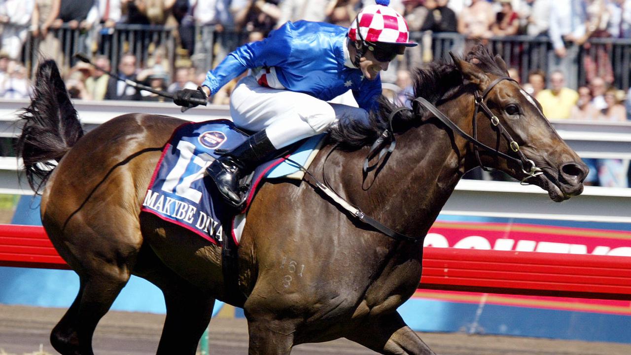 NOVEMBER 4, 2003 : Racehorse Makybe Diva ridden by jockey Glen Boss crosses the finish line to win the Melbourne Cup at Flemington 04/11/03. Turf A/CT