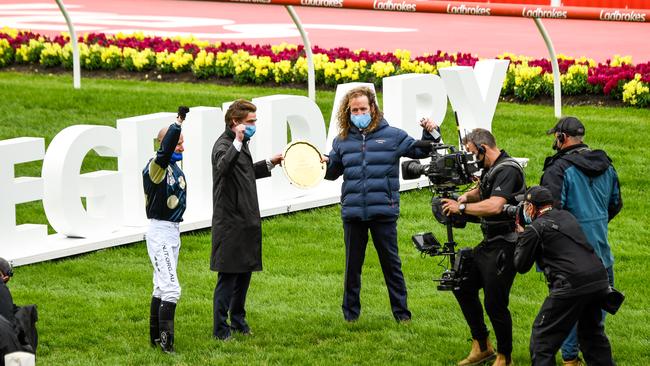 Winning jockey Glen Boss and co-trainers Ciaron Maher and David Eustace (centre).