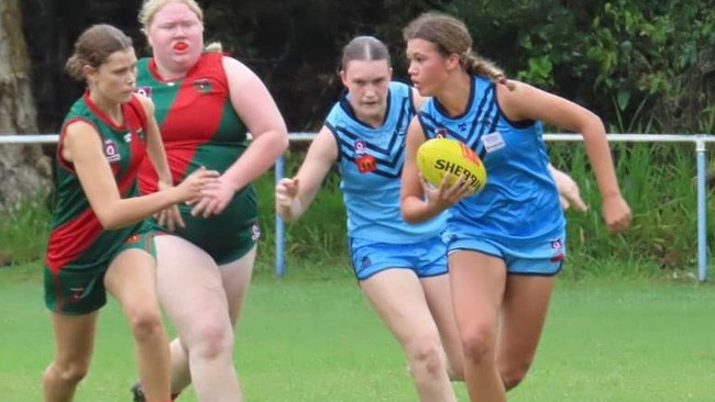 Wynnum's Charity Wightman-Beaven with the ball and Mackenzie Hale looking on