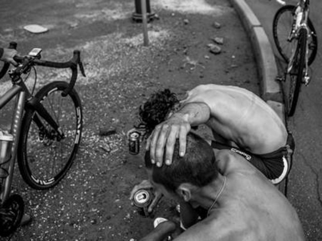 Lachlan and Angus stop for a rest while riding from Port Macquarie to Uluru. Picture Scott Mitchell