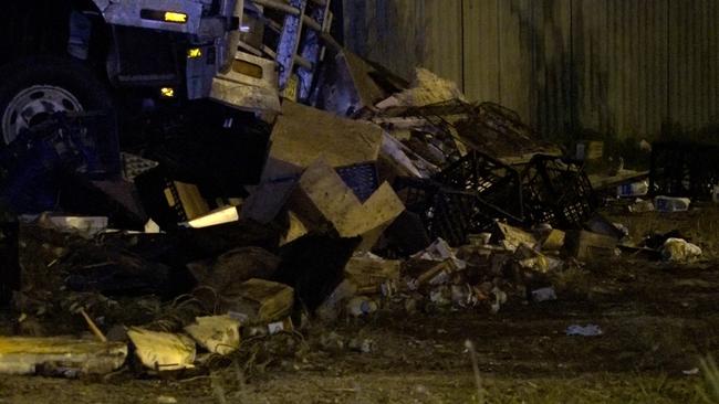 The impact of the crash left food and drink, including cases of Krispy Kreme donuts, strewn across the roadway. Picture: Digicrew Australia