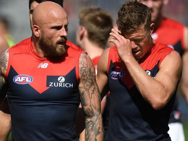 Nathan Jones (left) and Jake Melksham of the Demons are seen at half-time during the Second Preliminary Final between the West Coast Eagles and the Melbourne Demons at Optus Stadium in Perth, Saturday, September 22, 2018. (AAP Image/Julian Smith) NO ARCHIVING, EDITORIAL USE ONLY