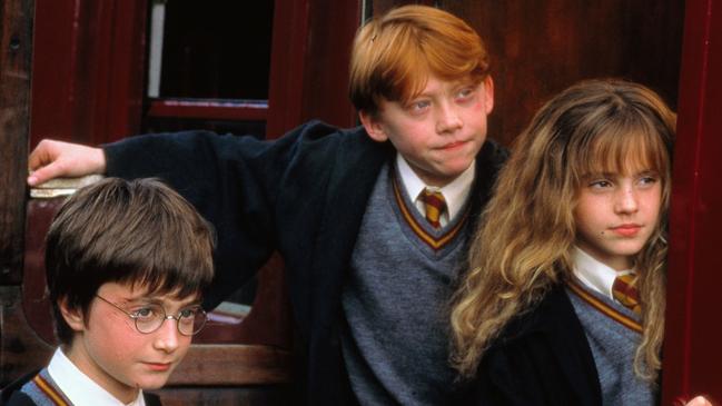 Daniel Radcliffe with Rupert Grint and Emma Watson in scene from film Harry Potter and the Philosopher's Stone. Picture: Warner Bros