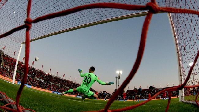 Sydney’s Adam Le Fondre slams a penalty home past Adelaide goalkeeper Paul Izzo following a VAR decision. Picture: AAP/Kelly Barnes