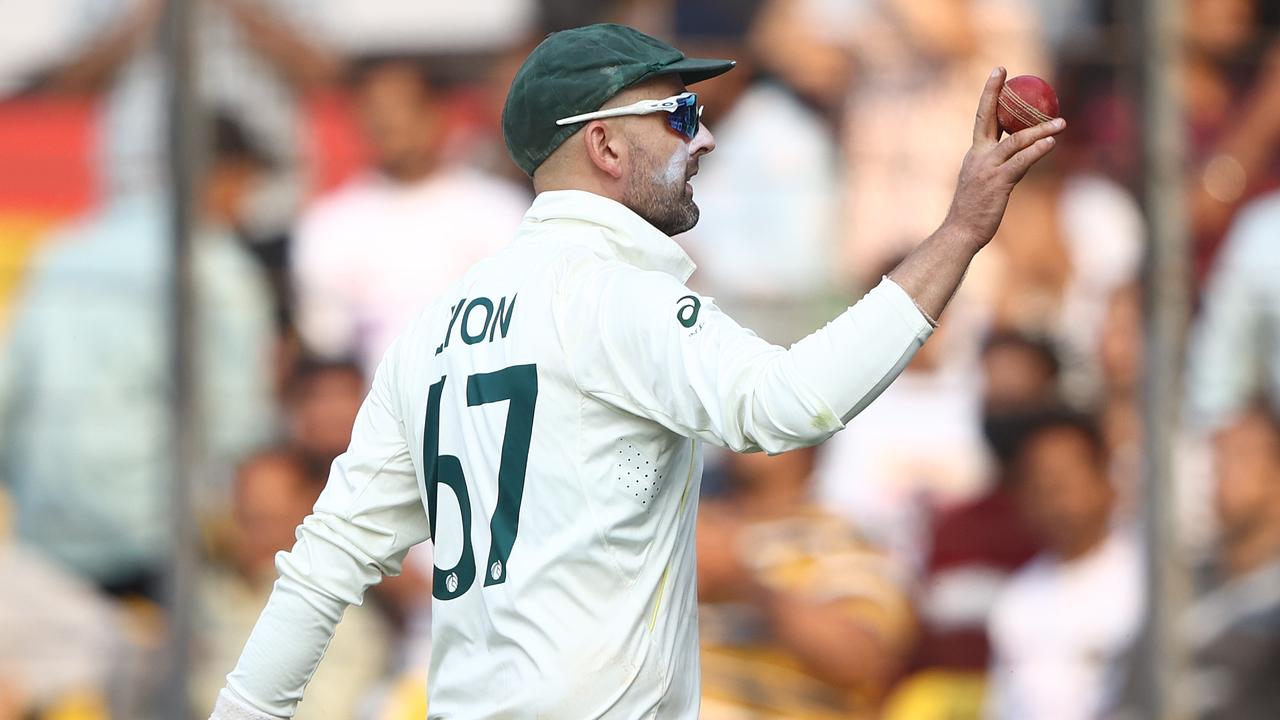 Nathan Lyon holds up the ball after his eight wickets. (Photo by Robert Cianflone/Getty Images)