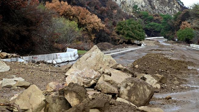 Mud and boulders cover a road near the Palisades Fire zone. Picture: Agustin Paullier / AFP