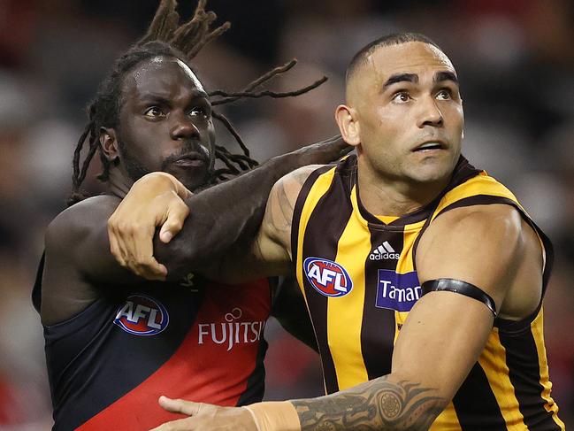 AFL Round 1. 20/03/2021.Essendon v Hawthorn at the Marvel Stadium, Melbourne.   Anthony McDonald-Tipungwuti of the Bombers  and Shaun Burgoyne of the Hawks battle for possession    . Pic: Michael Klein