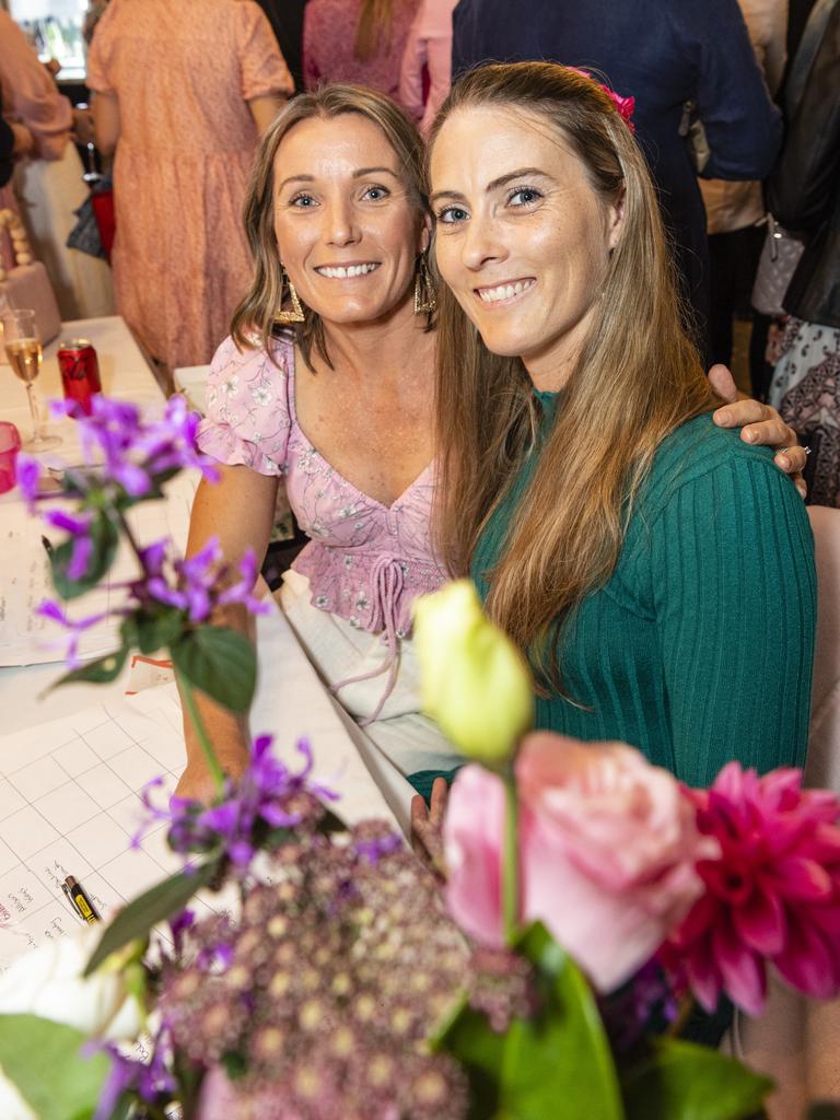 Nicole (left) and Brodie Lucht help out at the ladies cocktail night fundraiser for Protea Place at the Royal Hotel, Friday, April 29, 2022. Picture: Kevin Farmer