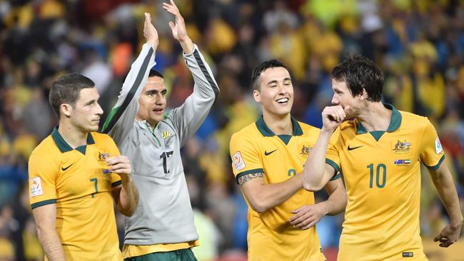 (L-R) Mathew Leckie, Tim Cahill, Jason Davidson and Robbie Kruse of Australia celebrate beating United Arab Emirates in their AFC Asian Cup semi-final football match in Newcastle on January 27, 2015. AFP PHOTO/Peter PARKS --IMAGE RESTRICTED TO EDITORIAL USE - STRICTLY NO COMMERCIAL USE