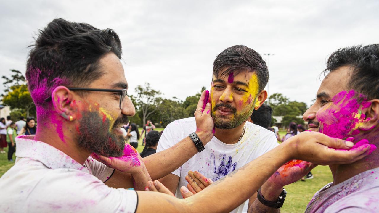 Celebrating Holi are (from left) Nikesh Giri, Bishal Bhandari and Janak Khadka as Toowoomba Indian and Nepalese communities unit for the festival of colours, Saturday, March 23, 2024. Picture: Kevin Farmer