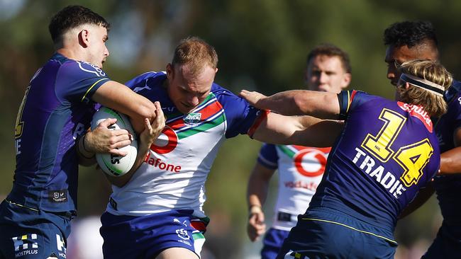 Warriors prop Matt Lodge is wrappeed up by the Storm defence. Picture: Daniel Pockett/Getty Images