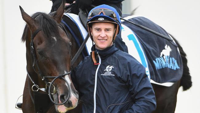 MELBOURNE, AUSTRALIA - OCTOBER 12: Zac Purton poses with Fame Game from Japan after he rode the horse during a trackwork session at Werribee Racecourse on October 12, 2015 in Melbourne, Australia. Fame Game is one of the favourites for Saturdays Group One Caulfield Cup. (Photo by Vince Caligiuri/Getty Images)