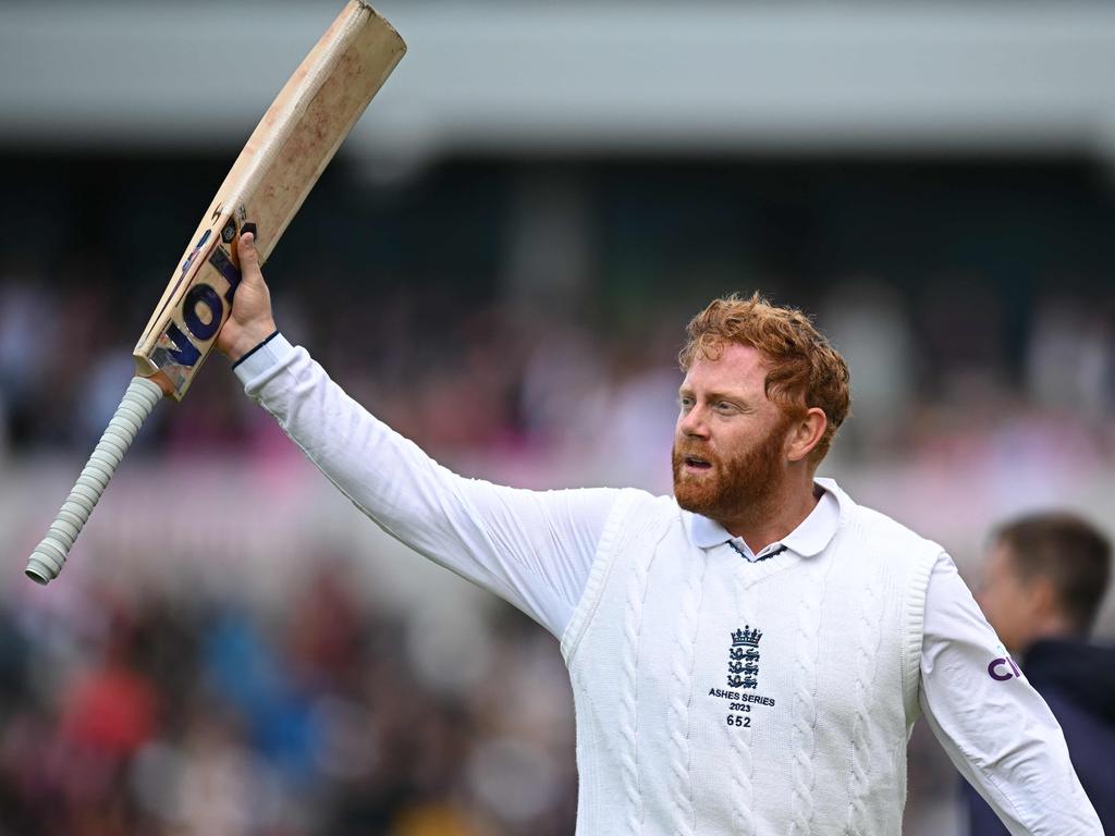 England's Jonny Bairstow raises his bat to the crowd as he leaves the field unbeaten on 99. (Photo by Oli SCARFF / AFP)