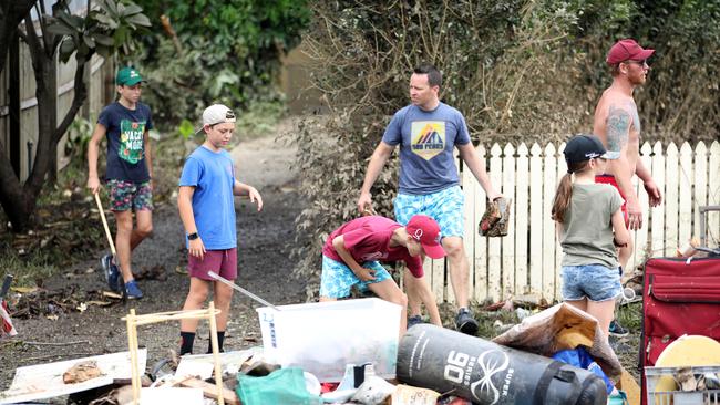 Cleaning up in Vincent St, Auchenflower. Picture: Annette Dew