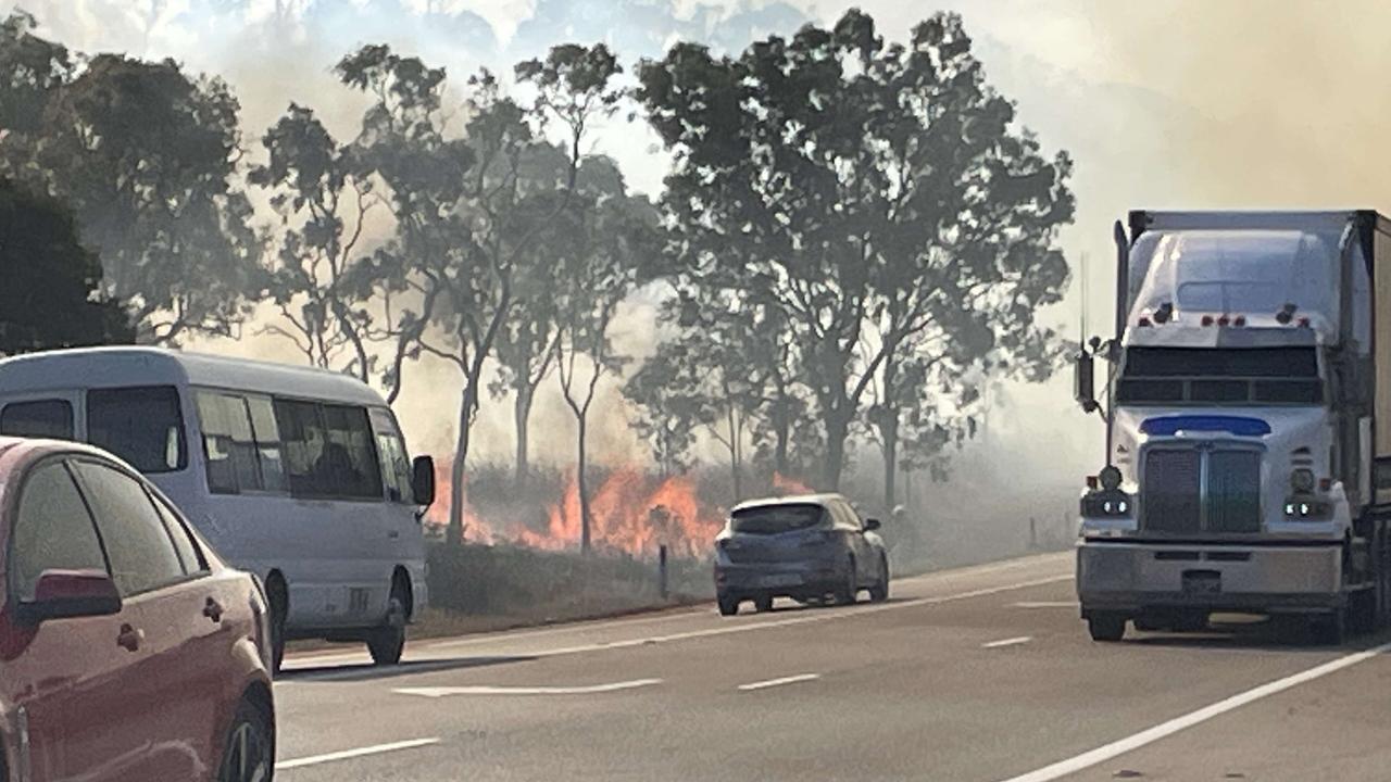 WATCH: Bruce Highway split in two as fireys battle blaze