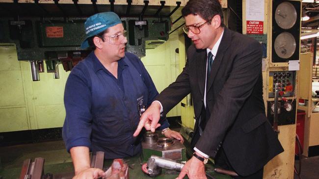 Steve Bracks with apprentice Peter McCarthy at the Ford plant in Geelong.