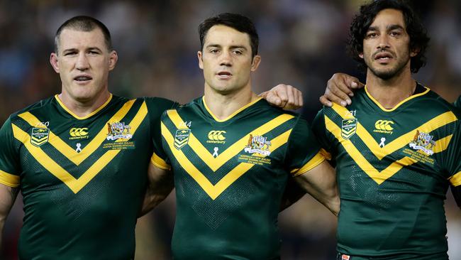 Paul Gallen, Cooper Cronk and Johnathan Thurston sing the national anthem in 2016.