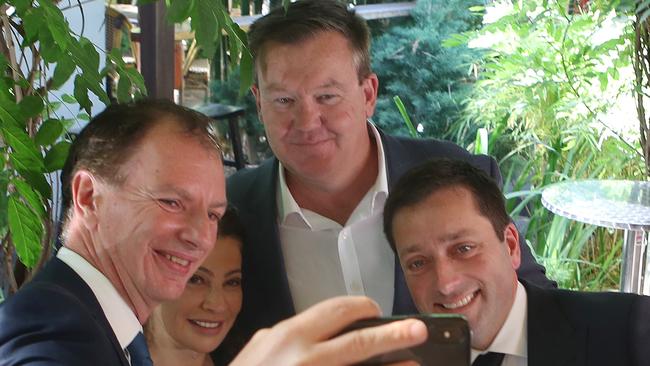 Frankston candidate Michael Lamb -pictured at the back, on the 2018 state election campaign trail - poses for a selfie with former Liberal Leader Matthew Guy (right) and MP David Southwick (left).