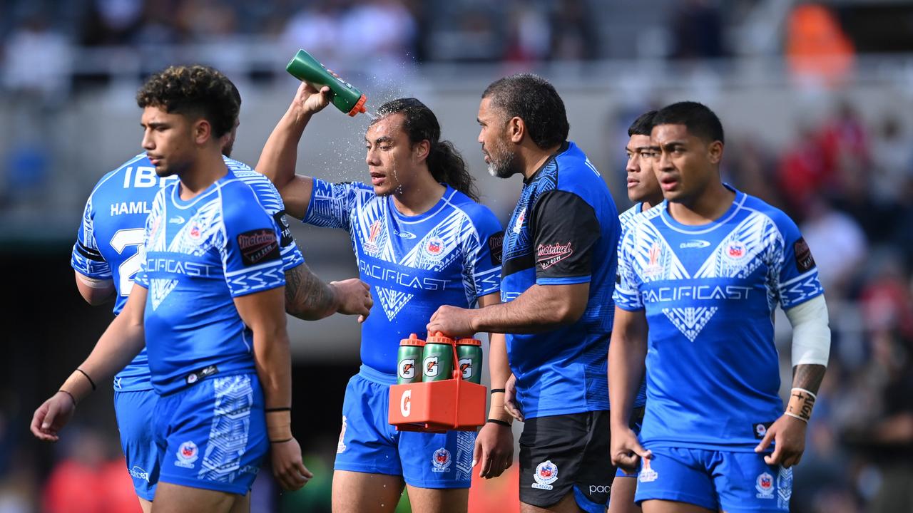 NEWCASTLE UPON TYNE, ENGLAND - OCTOBER 15: Jarome Luai of Samoa pours water on their head prior to the Rugby League World Cup 2021 Pool A match between England and Samoa at St. James Park on October 15, 2022 in Newcastle upon Tyne, England. (Photo by Stu Forster/Getty Images)