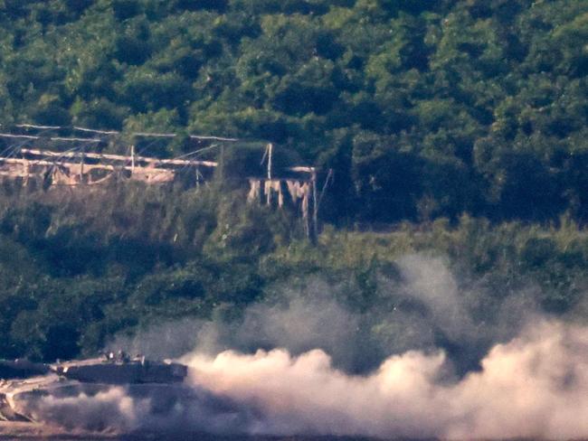 An Israeli tank rolls along the border with the Gaza Strip. Picture: AFP