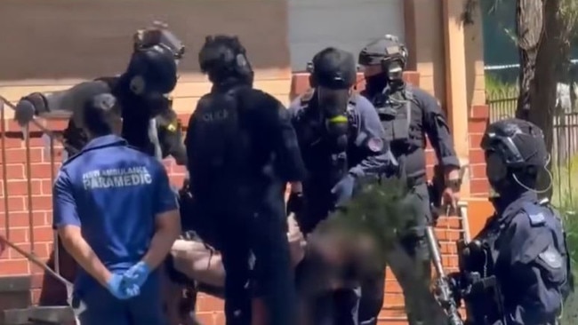 Heavily armed police during the standoff in West Kempsey on Sunday, December 15. Picture: NBN