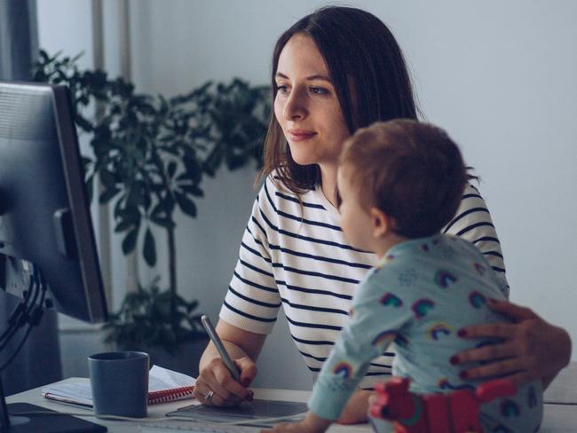 CHILD TECHNOLOGY -  Women working from home and playing with baby boy during pandemic isolation Picture: Istock