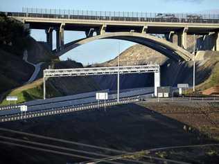 DRIVING TOLL: A toll point and signs for toll payment provider Linkt can be seen on an under-development section of the Toowoomba Second Range Crossing. Picture: Kevin Farmer