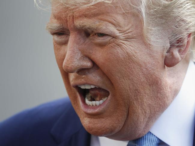 President Donald Trump speaking to the media on the South Lawn of the White House in Washington, Friday, Oct. 4, 2019, before his departure to nearby Walter Reed National Military Medical Center in Bethesda, Md. (AP Photo/Pablo Martinez Monsivais)