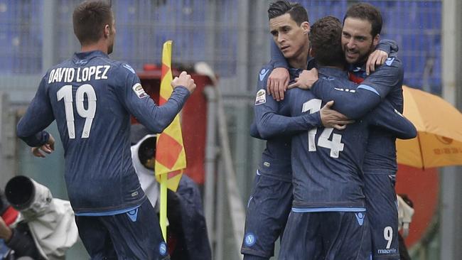 Napoli's Gonzalo Higuain, right, celebrates with his teammates.