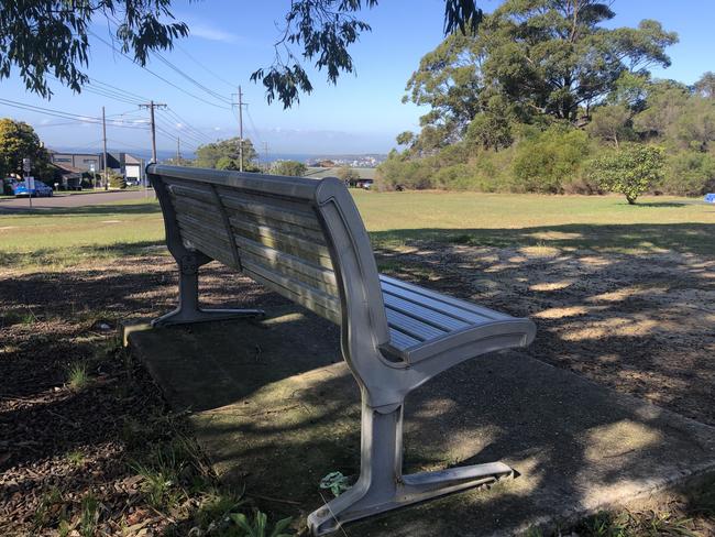 A seat, with a memorial plaque attached, at Goroka Reserve, Beacon Hill, with a northeast view towards Manly and North Head. Picture: Jim O’Rourke