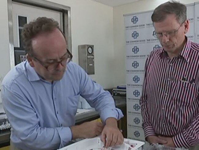 John Fraser and David McGiffin with the device that preserves hearts far longer than previously possible.