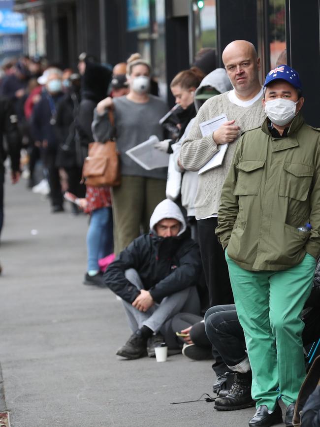 A large queue at the Richmond Centrelink in Richmond at 8am on Tuesday. Picture: David Crosling