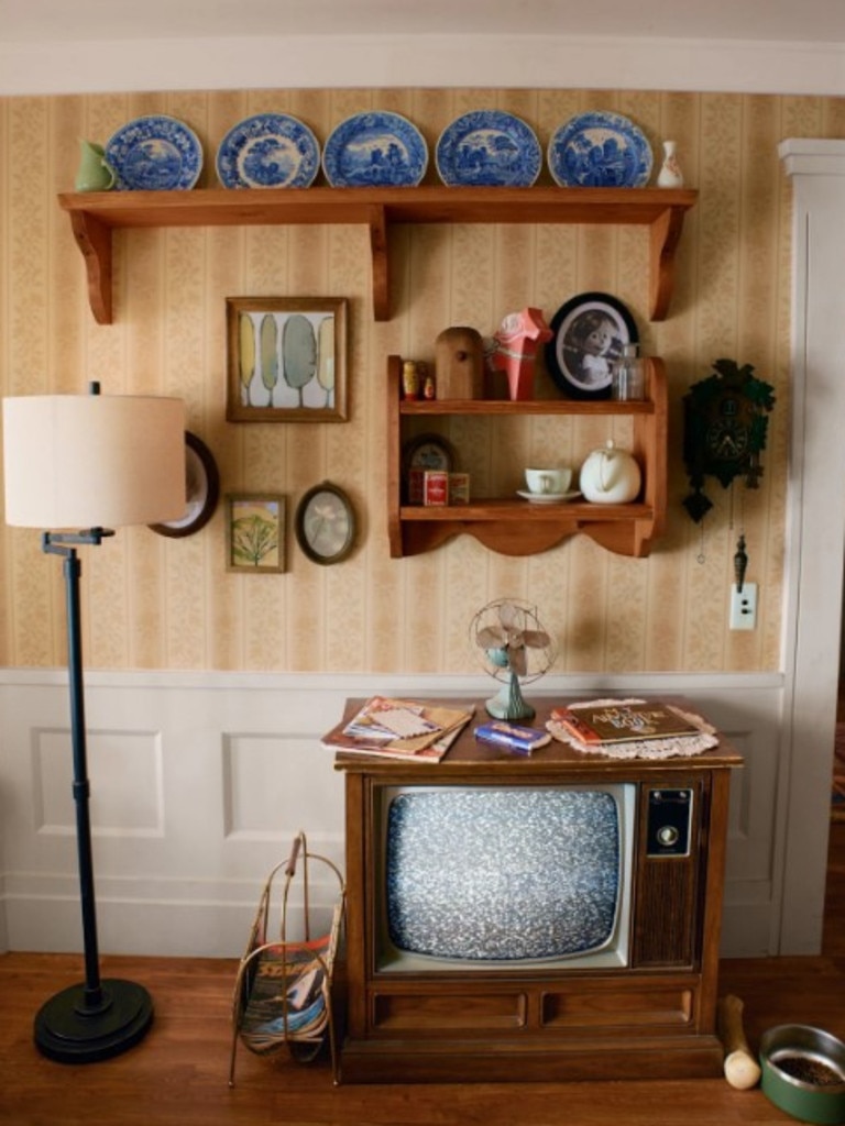 Props like the old-style TV and the crockery lining the wall bring authenticity to experience for guests lucky enough to have a real stay. Picture: supplied/Airbnb