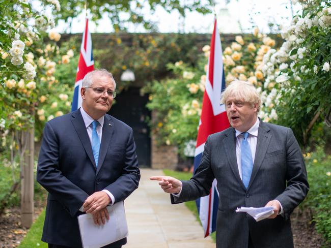 LONDON, ENGLAND - JUNE 15: UK Prime Minister Boris Johnson (R) and Australian Prime Minister Scott Morrison in the garden of 10 Downing Street, after agreeing the broad terms of a free trade deal between the UK and Australia, on June 15, 2021 in London, England. The leaders met as the two countries announced one of Britain's first post-Brexit trade deals. (Photo by Dominic Lipinski - WPA Pool/Getty Images)