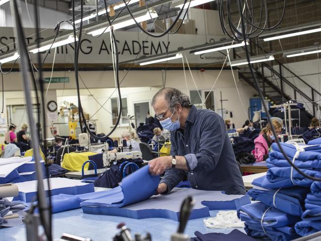 Employees at 'Fashion Enter' make scrubs for NHS staff in London. Picture: Getty