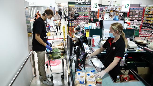 Volunteer Rupert Stobo shops for someone in need in Auckland, New Zealand.