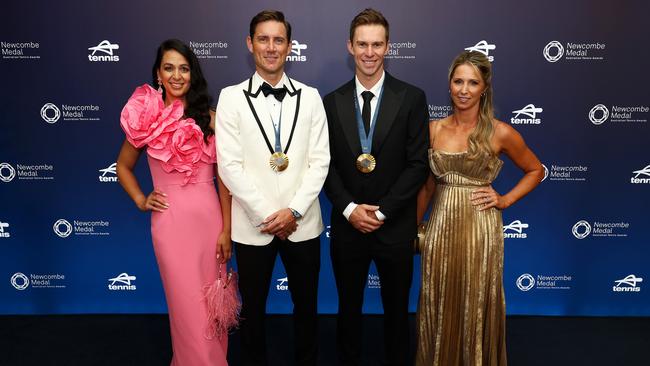 Matt Ebden and John Peers wear their Paris Olympics 2024 gold medals as they arrive with their partners Kim Doig (L) and Danielle Montgomery (R). (Photo by Graham Denholm/Getty Images for Tennis Australia)