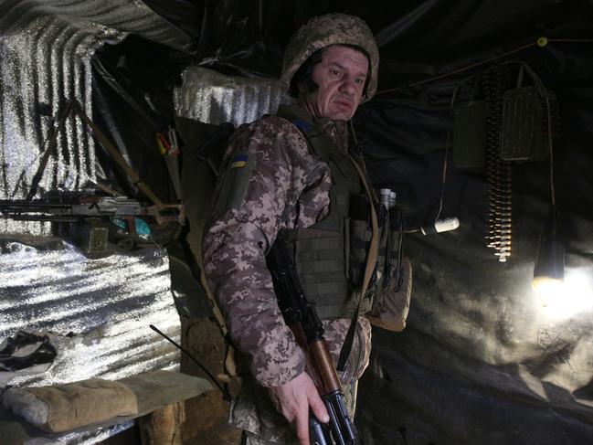 A Ukrainian Military Forces serviceman looks on in a dugout on the frontline with Russia-backed separatists near Gorlivka, Donetsk region. Picture: AFP