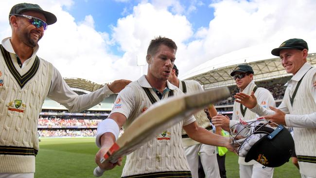 David Warner (C) is congratulated by teammates. Picture: William West/AFP