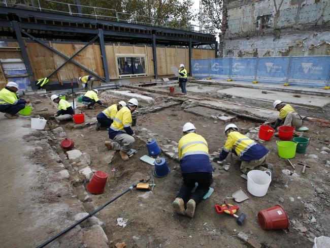 Workers undertake the dig behind Young and Jackson. Picture: David Caird