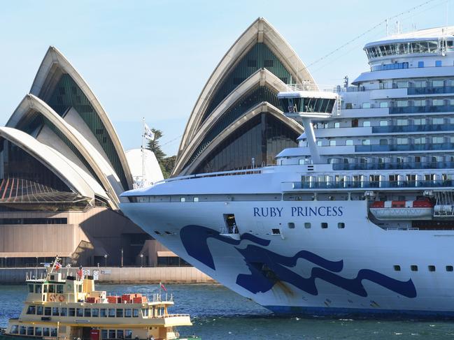 The Ruby Princess cruise ship departs the Overseas Passenger terminal in Circular Quay on March 19, 2020 in Sydney, Australia.