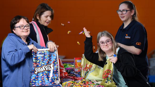 Bedford Industries workers Heather Jones, Zoia Tomlin, Tess Rogers and Tayla Morgan packing showbags for the Adelaide and Melbourne Royal Shows at Bedford Industries. Picture: Mark Brake