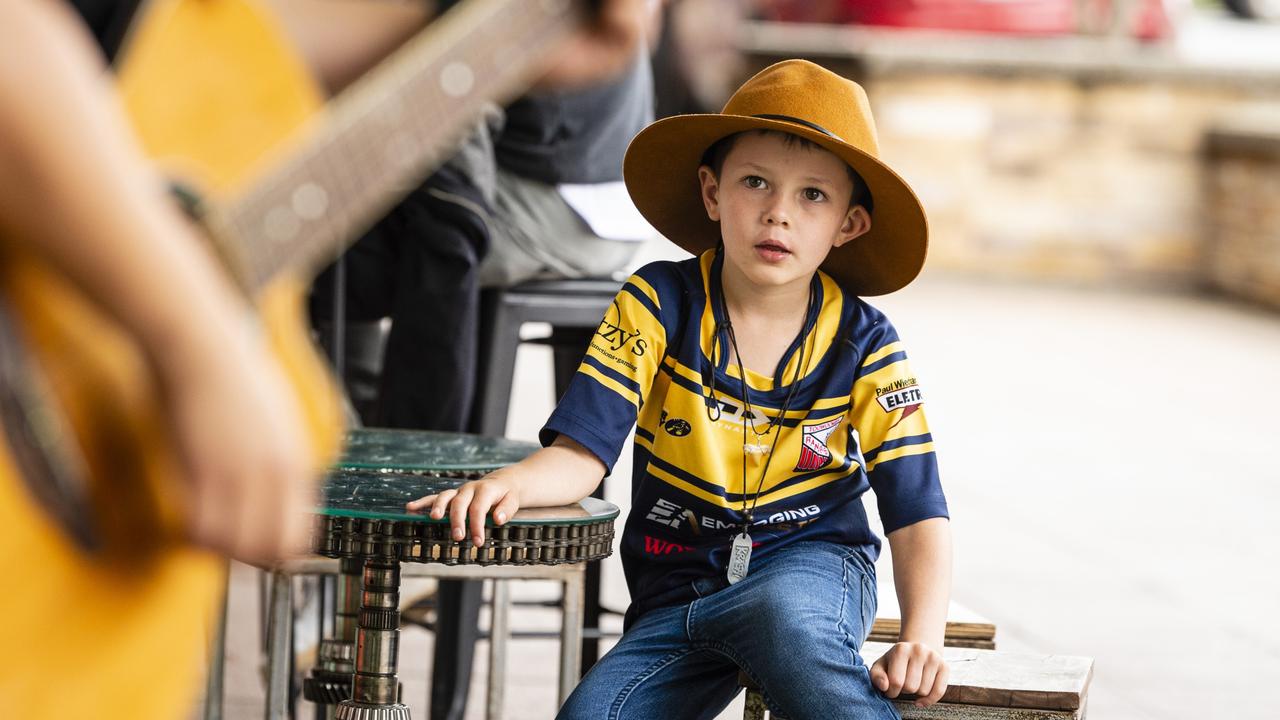 Six-year-old Charlie Bell watches Vanessa Miller perform as part of the Toowoomba Busking Festival, Saturday, April 30, 2022. Picture: Kevin Farmer
