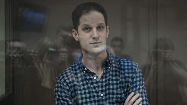 US journalist Evan Gershkovich, arrested on espionage charges, stands inside a defendants' cage before a hearing to consider an appeal on his arrest at the Moscow City Court in Moscow on Tuesday night. Picture: AFP