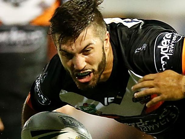 SYDNEY, AUSTRALIA - MARCH 14: James Tedesco of the Tigers is tackled during the round two NRL match between the Wests Tigers and the Manly Sea Eagles at Leichhardt Oval on March 14, 2016 in Sydney, Australia. (Photo by Mark Nolan/Getty Images)