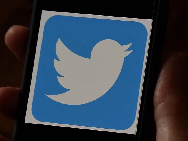 (FILES) In this file photo illustration, a Twitter logo is displayed on a mobile phone on May 27, 2020, in Arlington, Virginia. - Twitter on May 4, 2021 said it is buying Scroll and its ad-free news app to bolster a coming subscription service, and channel money to journalism in the process.The global one-to-many messaging platform did not disclose how much it is paying for Scroll, which owns the Nuzzel app.