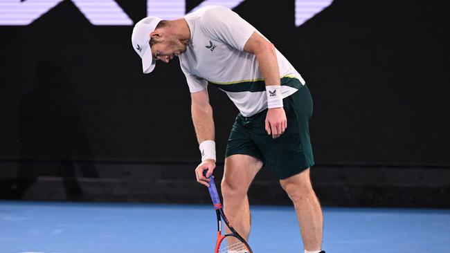 Britain's Andy Murray reacts as he plays against Spain's Roberto Bautista Agut during their men's singles match on day six of the Australian Open tennis tournament in Melbourne on January 21, 2023. (Photo by WILLIAM WEST / AFP)